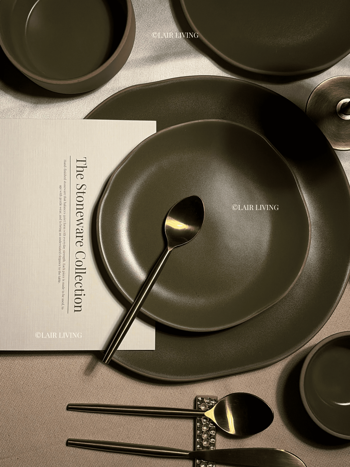 Verdant matte olive dinner plate with gold cutlery and Stoneware Collection card — Lair Living handmade ceramic