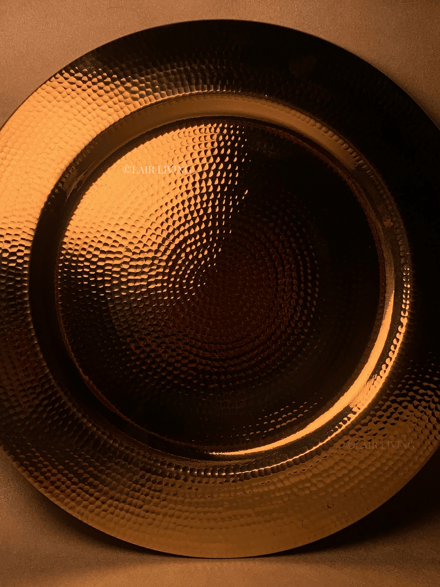 Luxury pure brass hammered charger plate by Lair Living, perfect for elevating your dining experience. This elegant and durable piece is ideal for luxury dining settings and best for gifting. Best in India for premium tableware.