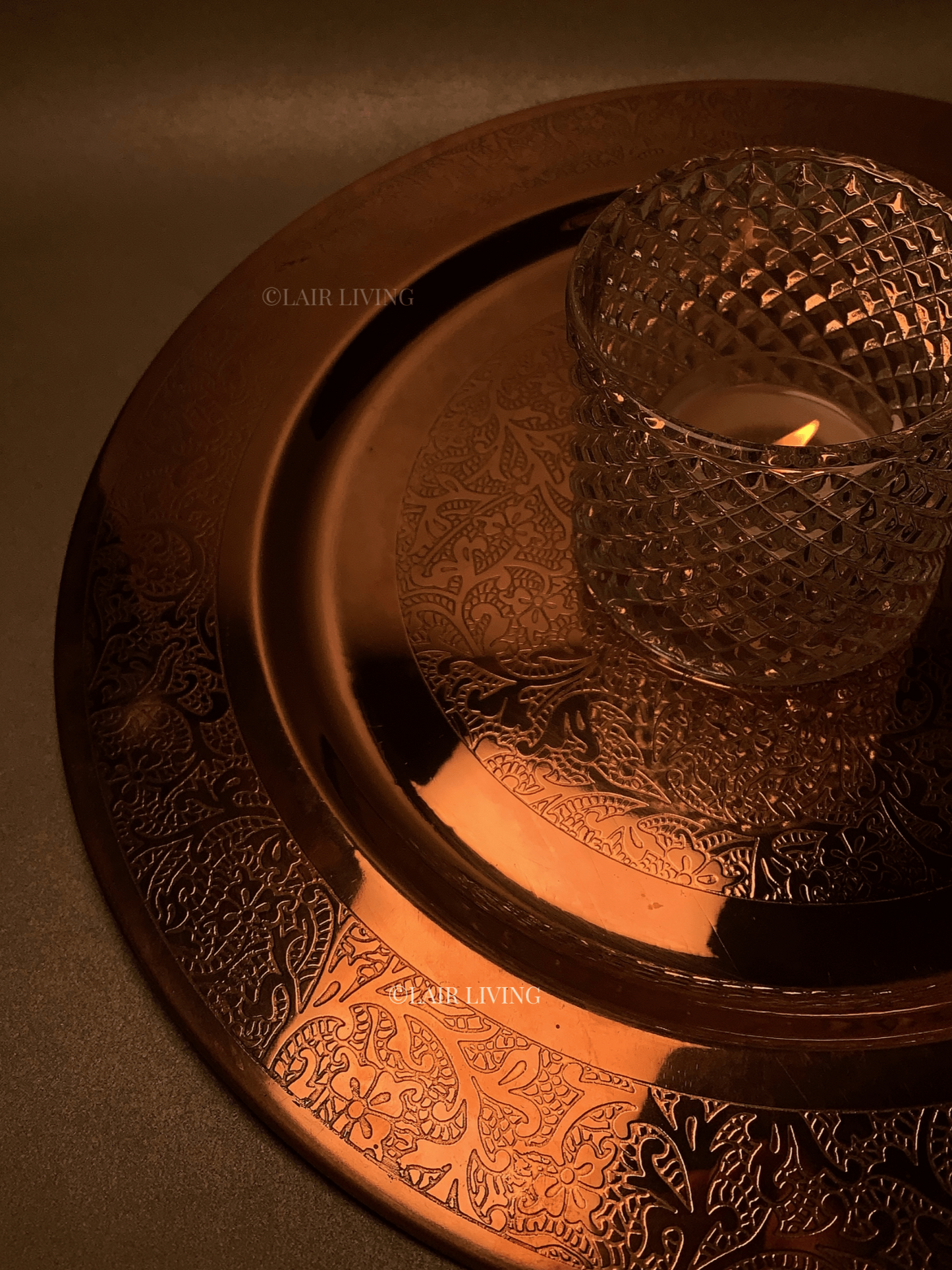 Lair Living's luxury pure copper charger plate with intricate edged design, ideal for fine dining. This premium copper plate enhances any dining table with elegance and style. Best in India for luxury tableware and gifting.