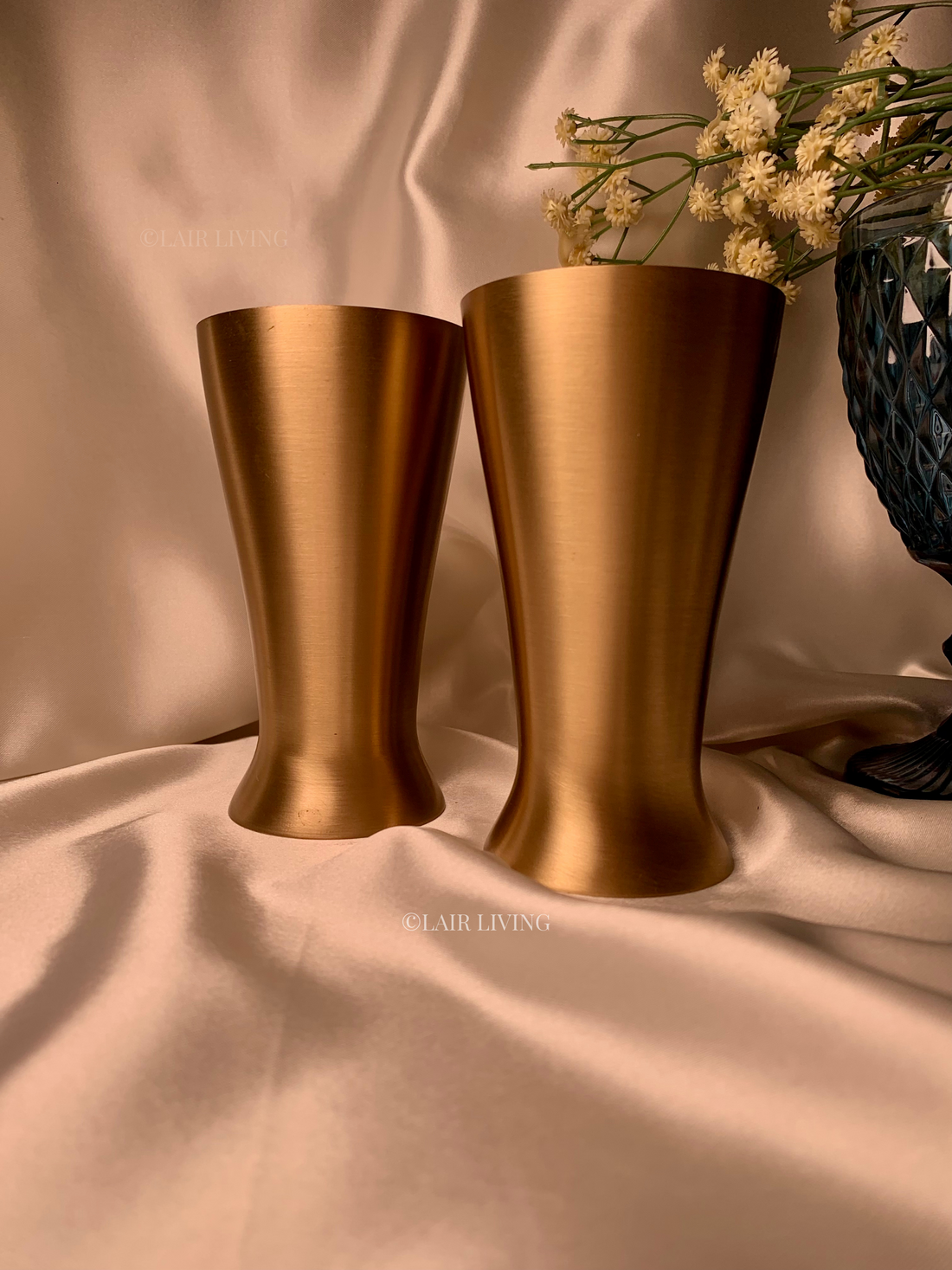 Close-up of a pure brass tumbler showing natural surface patina