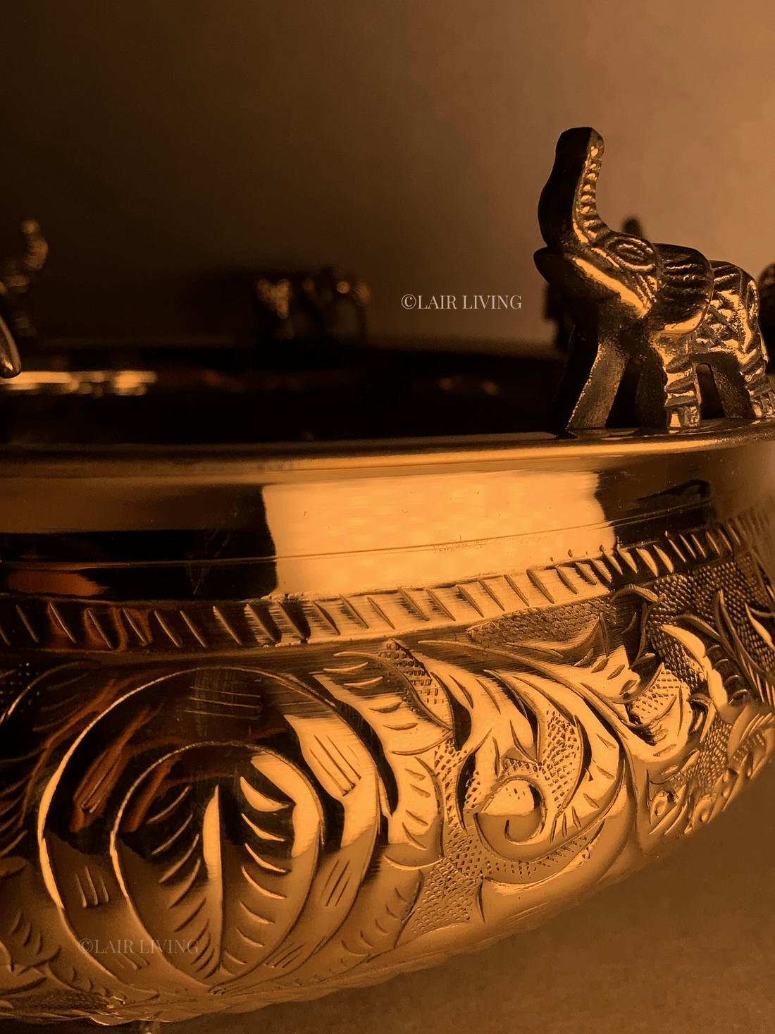 Urli decoration ideas - brass elephant urli styled with flowers and candles India