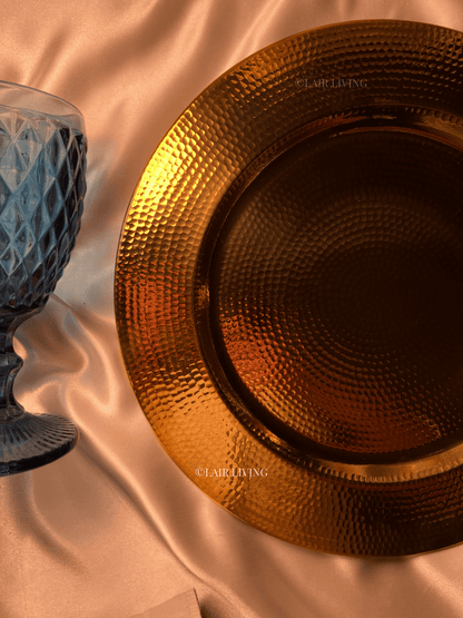 Luxury pure brass hammered charger plate by Lair Living, perfect for elevating your dining experience. This elegant and durable piece is ideal for luxury dining settings and best for gifting. Best in India for premium tableware.