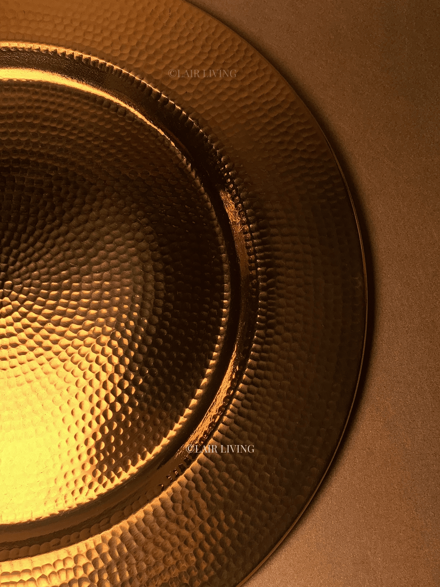 Luxury pure brass hammered charger plate by Lair Living, perfect for elevating your dining experience. This elegant and durable piece is ideal for luxury dining settings and best for gifting. Best in India for premium tableware.